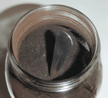 Asphaltum powder in large mason jar
