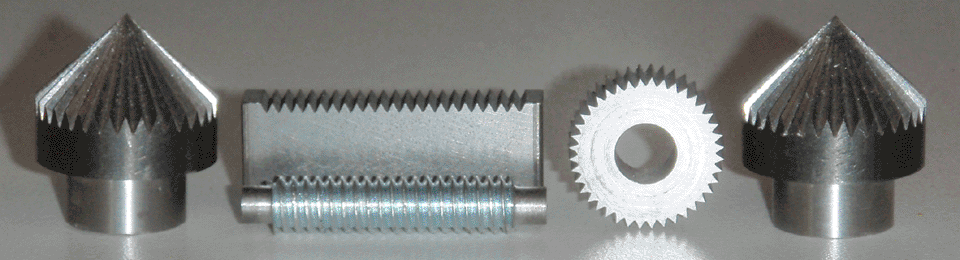 Set of machined gears, with 1/4-20 thread for reference