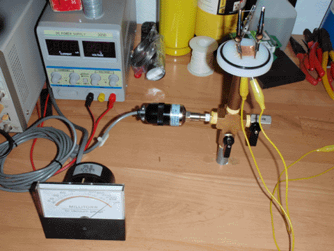 Close-up of vacuum system, showing valves and thermocouple gauge