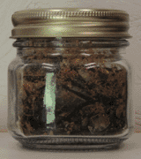 Hardened pine rosin in mason jar