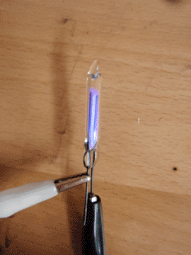 Glow tube with high voltage applied