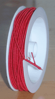 Spool of fiber-insulated wire
